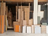 several pieces of wood are stacked up in a garage