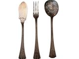three spoons and a fork on a white background