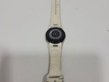 a close up of a smart watch on a white surface