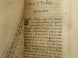 an old book with a drawing of a city on it