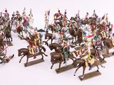 a lot of figurines of people riding on horses