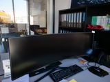 an image of a computer desk with a monitor and keyboard