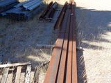 a pile of wood sitting in the middle of a field