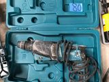 a blue box with a drill and other tools in it
