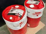 two red and white barrels sitting next to each other