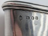 a close up of a silver plate with a number on it