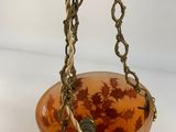 a close up of a hanging planter on a white background