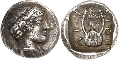 a silver coin with an image of a woman on it