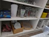 a pantry with a lot of food and drinks on the shelves