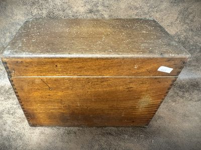 a wooden box that has a tag on it