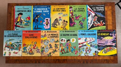 several children ' s books are lined up on a wooden table
