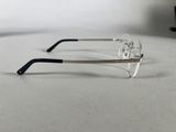 a pair of glasses sitting on a table next to a pair of glasses