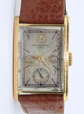 an image of a watch with a brown leather strap