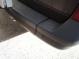 a close up of a car ' s rear bumper