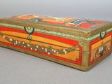 a small wooden box that has a design on it