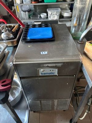an image of a commercial kitchen with a lot of cooking utensils