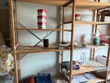 a shelf with pots and pans on it in a room