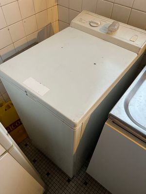 a washer and a dryer in a small room