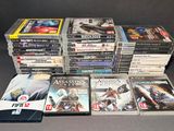 a lot of video games sitting on a table