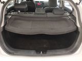 the back of a car with its trunk open and the seats folded down