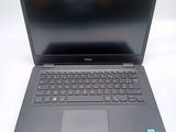 the dell laptop is open and ready to be used
