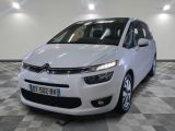 the white citrole is parked on a checkered floor