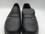 a pair of black leather shoes on a white surface