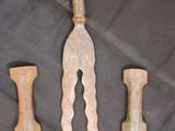 several different types of knives are displayed on a black cloth