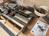 a machine that is sitting on the floor next to a box