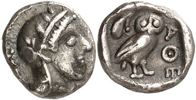 a silver coin with an image of a bird on it