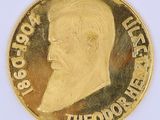an image of a gold coin with a portrait of a man on it