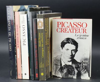 several books are stacked on top of each other on a table