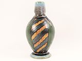 a small vase with a black and orange stripe on it