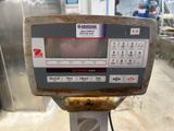 a close up of a digital scale in a factory