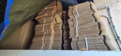 a large amount of stacks of money sitting in a box