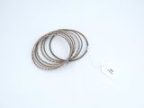 a close up of a string bracelet with a tag on it