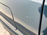 a close up of a car door handle with a sticker on it
