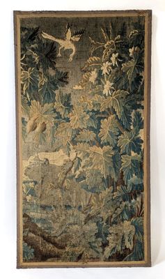 an image of a tapestry hanging on a wall next to a white wall