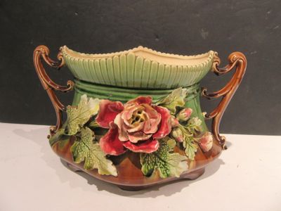 a vase with flowers on it sitting on a table