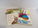 several books on a white table with a white background