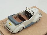 a small toy car sitting on top of a cardboard box