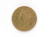 une pièce d'or avec l'image d'une femme dessus