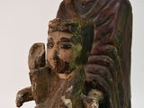 a statue of a man holding a bird in his hand