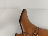 tan leather ankle boots with buckles and buckles on the heel