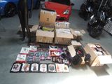 a lot of assorted items on the floor in a garage