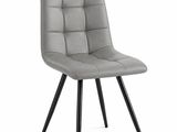 une chaise grise aux pieds noirs sur fond blanc