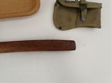 a knife, a tray, and a knife rest on a table
