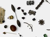 many different types of jewelry on a white surface