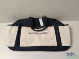 a white and blue bag sitting on top of a table