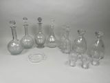 a lot of glass bottles that are sitting on a table